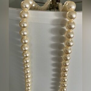Vintage Strand of cultured pearls with a yellow gold filigree clasp.